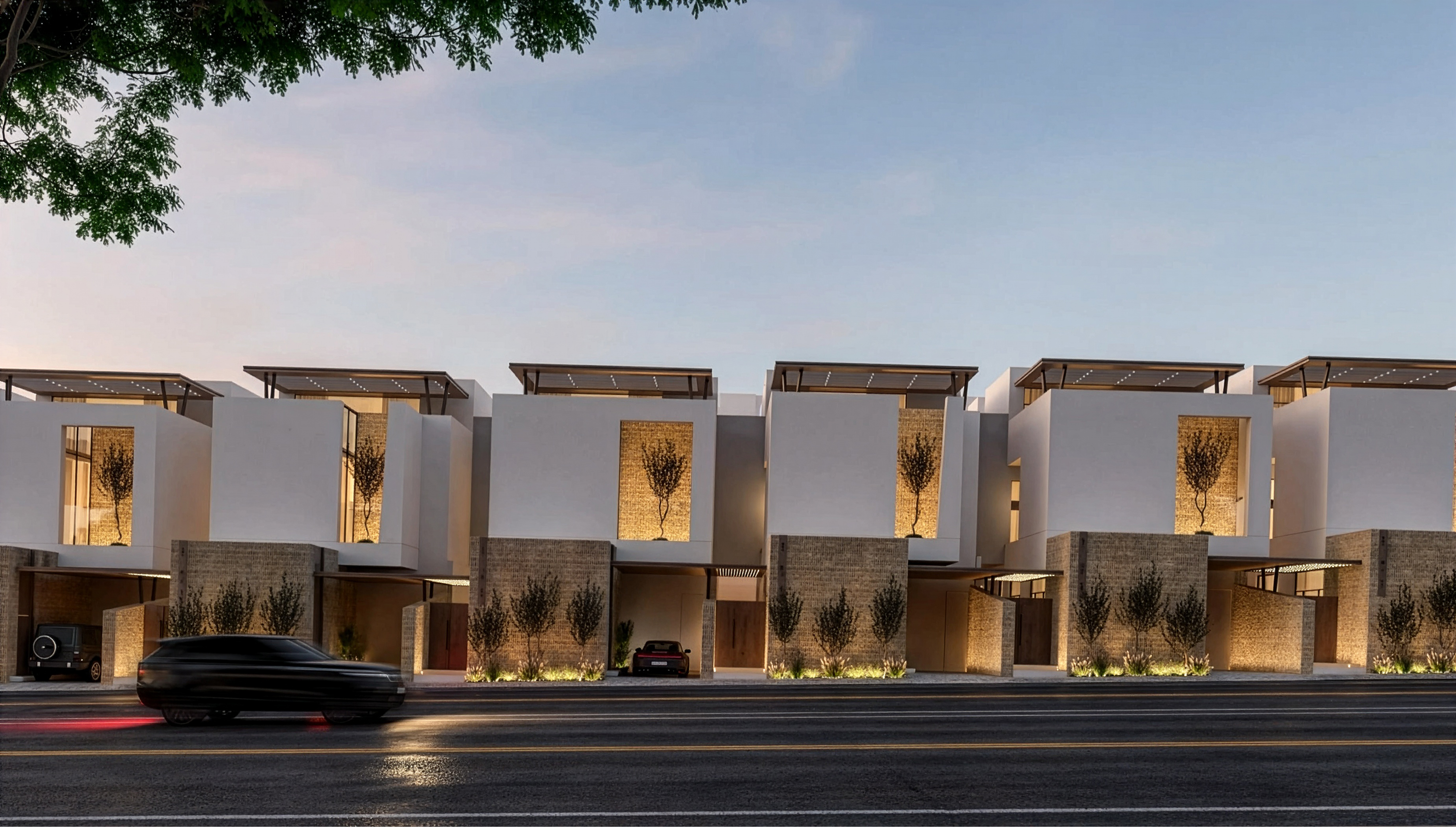 Row of residential villas along a street at dusk
